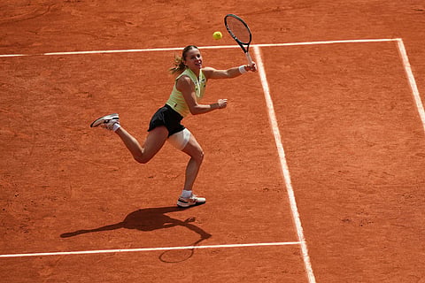 Poland's Maja Chwalinska returns to Russia's Mirra Andreeva during their final women's tennis match at the French Open in Paris.