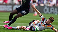 AP Photo : Germany midfielder Joshua Kimmich, right, controls the ball under United States forward Folarin Balogun during the first half of an international friendly soccer match in Chicago.