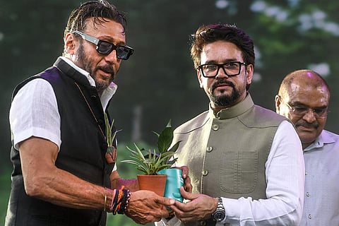 Union Minister Anurag Thakur, right, along with actor Jackie Shroff presents saplings to each other on the occasion of World Environment Day, in Mumbai, Maharashtra.