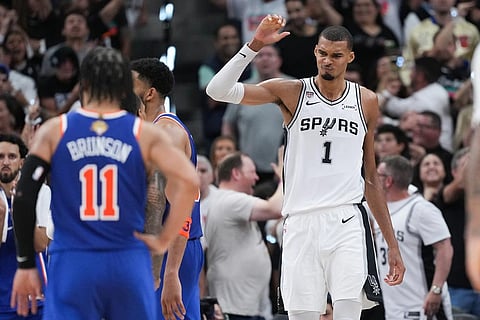 San Antonio Spurs forward Victor Wembanyama (1) celebrates a basket against the New York Knicks during the second half of Game 2 of the NBA Finals basketball series in San Antonio.