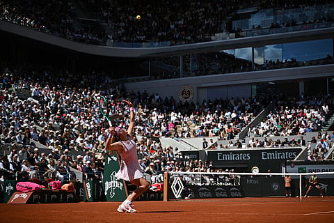 Russia's Mirra Andreeva serves during the final tennis match against Poland's Maja Chwalinska at the French Open in Paris.