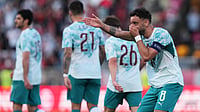 AP Photo : Portugal's Bruno Fernandes celebrates after scoring his side's second goal during an international friendly soccer match between Portugal and Chile in Oeiras, outside Lisbon.