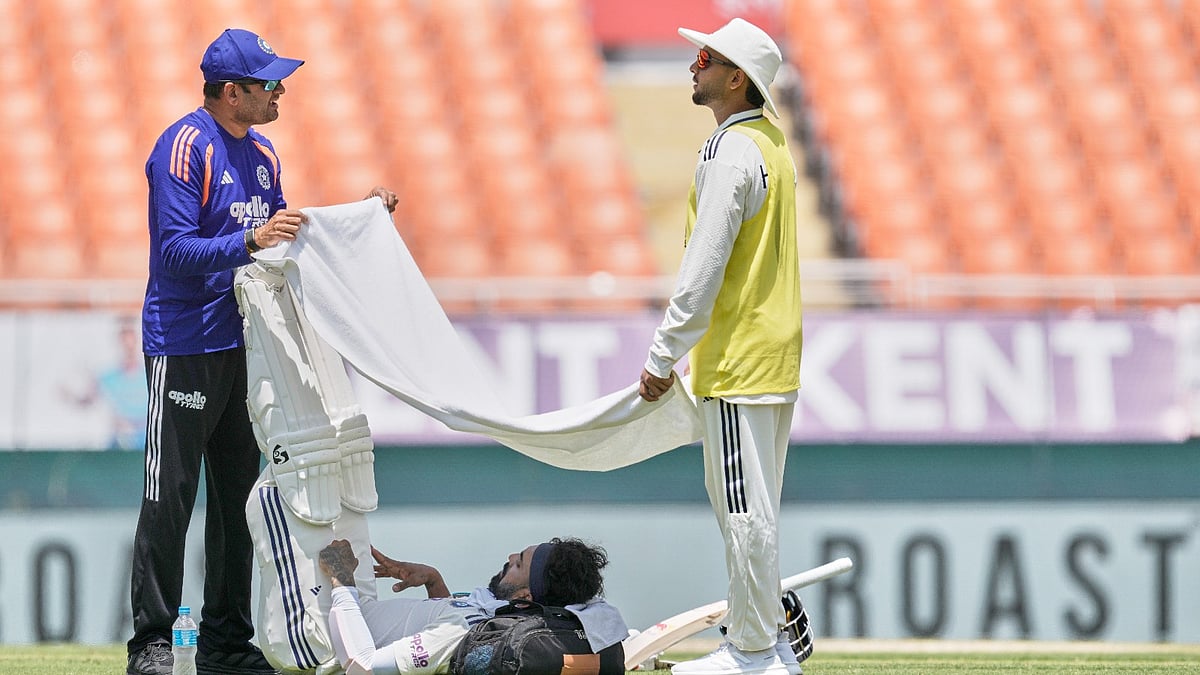 India's KL Rahul seeks respite from the mid-day heat during a drinks break on day one of the cricket test match between Afghanistan and India in New Chandigarh, India, Saturday, June 6, 2026. - AP Photo/Ashwini Bhatia)