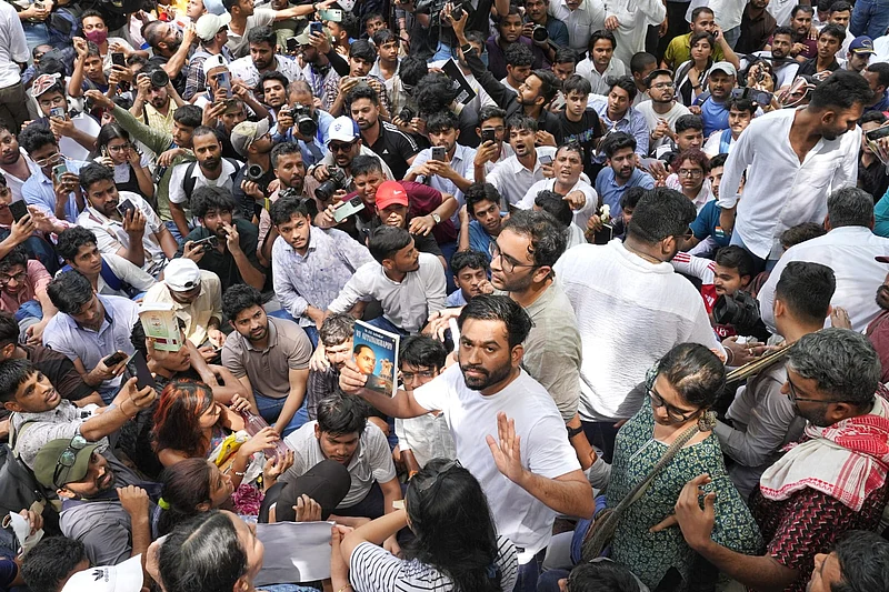 Suresh K Pandey : Abhijeet Dipke at the protest holding the autobiography of BR Ambedkar.