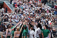 Maja Chwalinska Vs Mirra Andreeva, French Open 2026 In Pics: See Best Photos From Roland Garros Final | Photo: AP/Emma Da Silva : Dancers perfom before the final tennis match between Poland's Maja Chwalinska and Russia's Mirra Andreevaat the French Open in Paris.