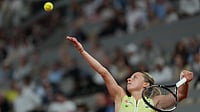 (AP Photo/Thibault Camus) : Poland's Maja Chwalinska serves to Russia's Diana Shnaider during the semifinal tennis match at the French Open in Paris, Thursday, June 4, 2026.