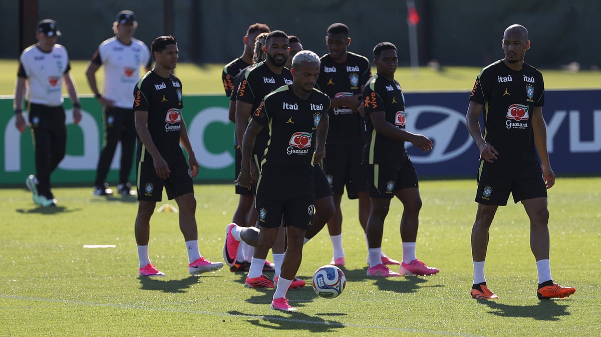 Members of the Brazilian national team walk on the field during a training session for the national soccer team. - AP Photo