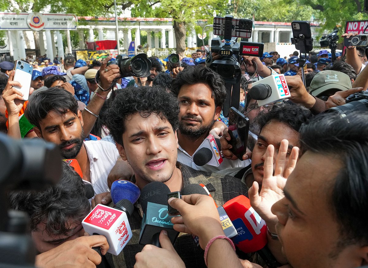 Cockroach Janta Party's (CJP) spokesperson Saurav Das speaks to the media as supporters gather amid heavy security deployment ahead of the arrival of the digital outfit's founder Abhijeet Dipke to seek permission to protest at Jantar Mantar, demanding the resignation of Union Education Minister Dharmendra Pradhan over alleged examination-related lapses, outside the Parliament Street Police Station, in New Delhi, Saturday, June 6, 2026.  - (PTI Photo/Arun Sharma)