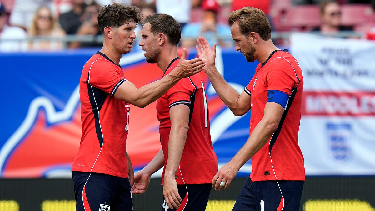 England forward Harry Kane, right, celebrates his goal against New Zealand with defender John Stones and midfielder Jordan Henderson (14) during the first half of an international friendly soccer match. - AP Photo