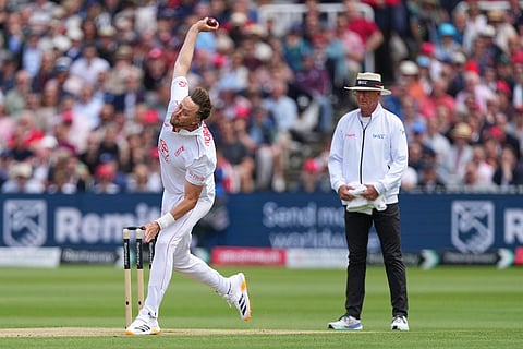 England's Ollie Robinson bowls during the second day of the test match between England and New Zealand at Lord's cricket ground in London.