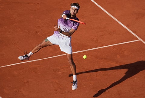 Italy's Flavio Cobolli returns during the final tennis match against Germany's Alexander Zverev at the French Open in Paris.