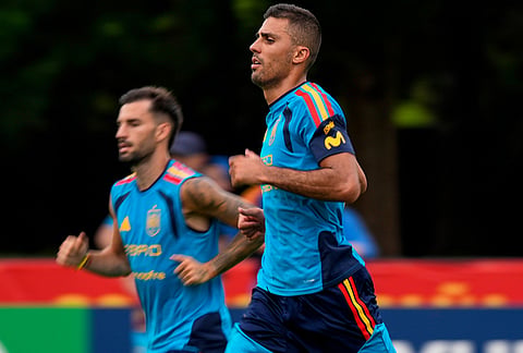 Spain's Rodri, right, works out with the team during a training session, in Chattanooga, Tennessee ahead of the World Cup soccer tournament. 