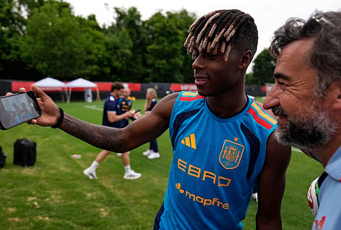 Spain's Nico Williams, left, takes a photo with fan Marcos Perez, right, of Atlanta, after a training session, Saturday, June 6, 2026, in Chattanooga, Tennessee ahead of the World Cup soccer tournament. 