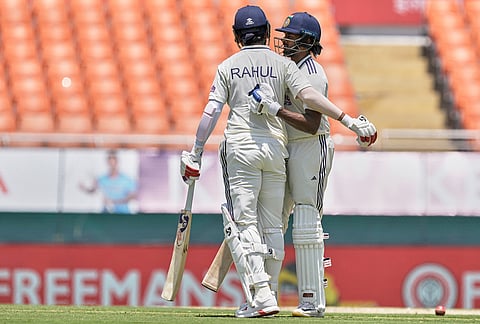 India's Sai Sudharsan, right, celebrates his fifty runs with batting partner KL Rahul on day one of the cricket test match between Afghanistan and India in New Chandigarh.