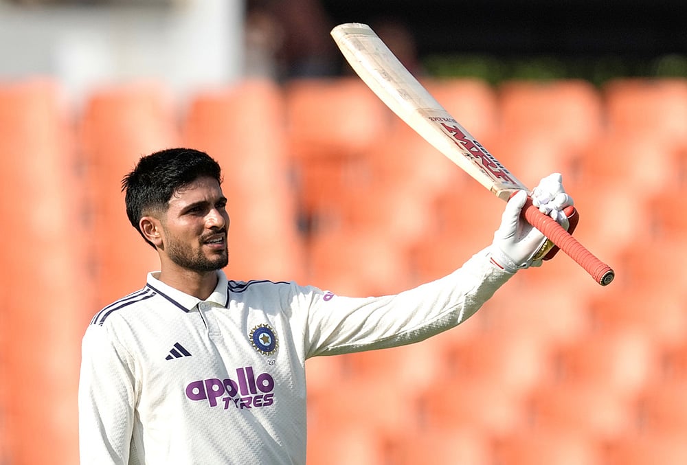 India's captain Shubman Gill celebrates his century on day one of the cricket test match between Afghanistan and India in New Chandigarh. - | Photo: AP/Ashwini Bhatia
