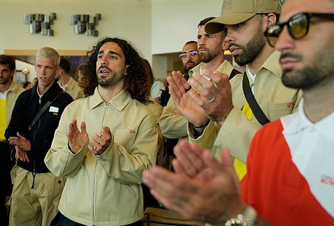 Spain defender Marc Cucurella, second from left, stands with teammates in the airport after arriving for the World Cup soccer tournament Friday, June 5, 2026, in Chattanooga, Tennessee.