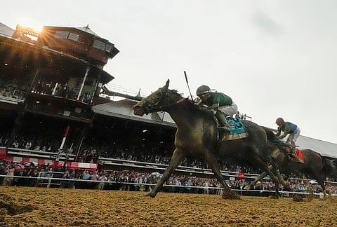 Golden Tempo (9), ridden by jockey Jose Ortiz, crosses the finish line aboard to win the 158th running of the Belmont Stakes horse race in Saratoga Springs, New York. 