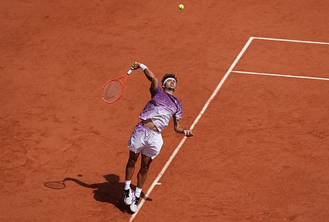 Italy's Flavio Cobolli serves during the final tennis match against Germany's Alexander Zverev at the French Open in Paris.