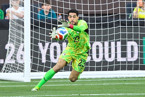 Egypt's Mostafa Shobeir reaches for the ball during an international friendly soccer match against Brazil in Cleveland.