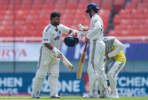 India's captain Shubman Gill, right, and Rishabh Pant on day two of a Test cricket match between India and Afghanistan, in Mullanpur.