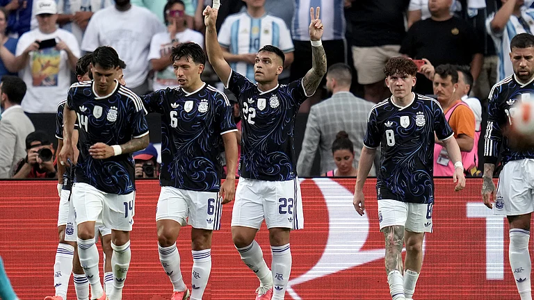 Argentina forward Lautaro Martínez (22) reacts after he scored on a penalty kick against Honduras during the first half of an international friendly soccer match Saturday, June 6, 2026, in College Station, Texas. - (AP Photo/Sam Craft)
