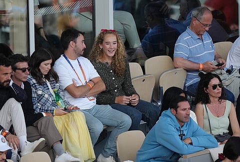 French Open women's singles winner Mirra Andreeva of Russia, centre, watches the men's final match between Flavio Cobolli of Italy and Alexander Zverev of Germany at the French Open tennis tournament in Paris.
