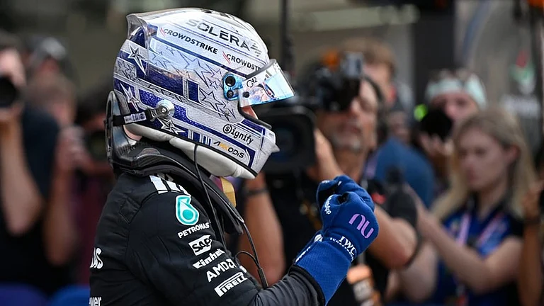 Mercedes driver Andrea Kimi Antonelli of Italy celebrates after setting the pole position during the qualifying session for the Monaco F1 Grand Prix, at the Monaco racetrack. - | Photo: AP/Philippe Magoni