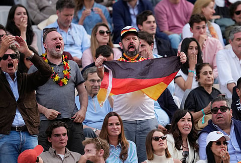 Fans support Alexander Zverev of Germany as he plays against Flavio Cobolli of Italy during the men's final match at the French Open tennis tournament in Paris.