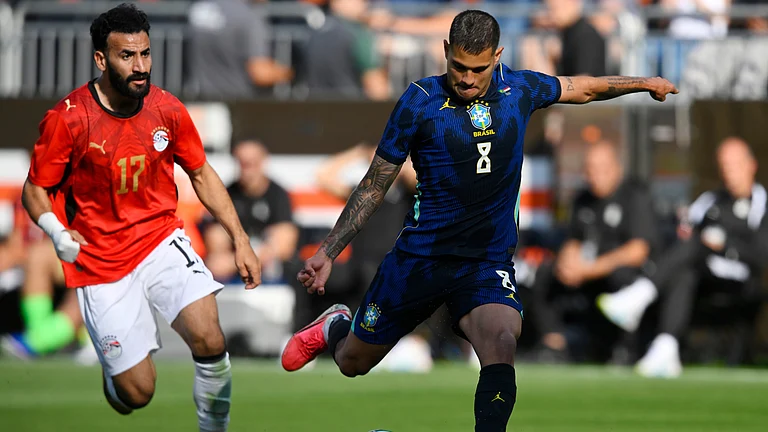 Brazil's Bruno Guimaraes (8) shoots beside Egypt's Mohanad Lasheen (17) to score during an international friendly soccer match in Cleveland. - AP Photo