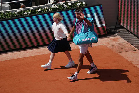 Flavio Cobolli of Italy enters the court for the men's final match against Alexander Zverev of Germany at the French Open tennis tournament in Paris.