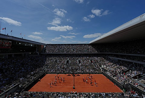 Dancers perform at the Court Philippe-Chatrier before men's final match between Flavio Cobolli of Italy and Alexander Zverev of Germany at the French Open tennis tournament in Paris.
