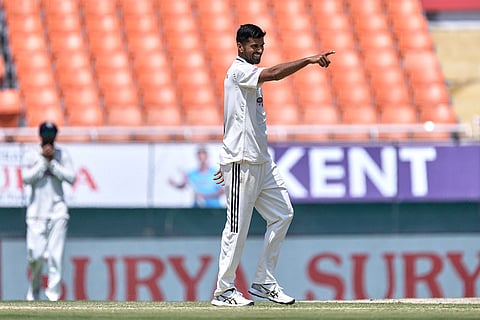 India's Washington Sundar celebrates the wicket of Afghanistan's Rahmat Shah on day three of the cricket test match between Afghanistan and India in New Chandigarh, India.