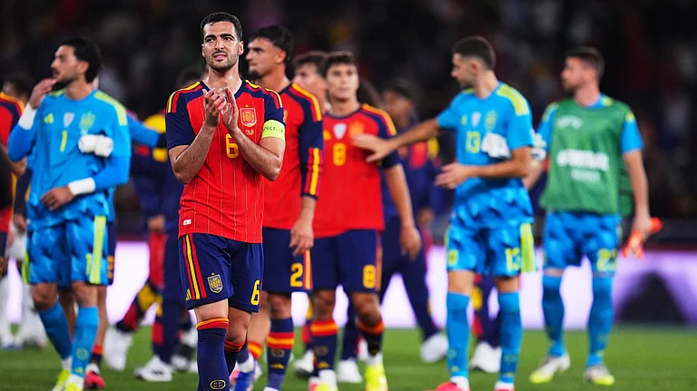 Spain's Mikel Merino applauds after an international friendly soccer match against Iraq in A Coruna, Spain. - AP Photo
