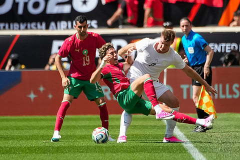 Norway forward Alexander Sorloth (7) fights for the ball against Morocco midfielder Neil El Aynaoui, front, during an international friendly soccer match in Harrison, N.J.