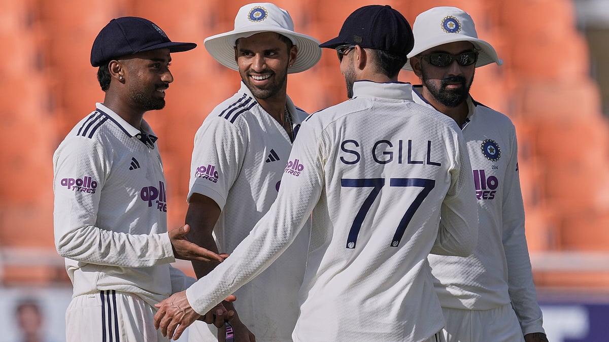India's Manav Suthar, left, celebrates with teammates the wicket of Afghanistan's Afsar Zazai on day two of the cricket test match between Afghanistan and India in New Chandigarh, India, Sunday, June 7, 2026. (AP Photo/Ashwini Bhatia) - (AP Photo/Ashwini Bhatia)