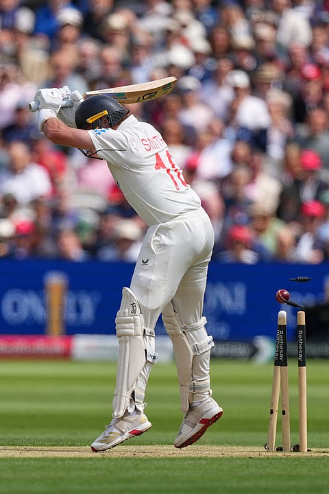 New Zealand's Nathan Smith is bowled during the second day of the test match between England and New Zealand at Lord's cricket ground in London.