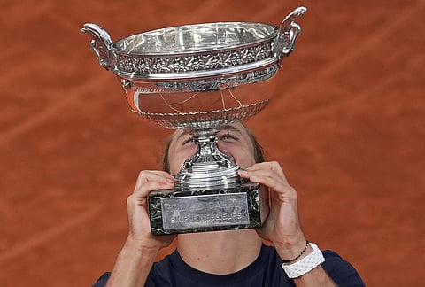 Germany's Alexander Zverev celebrates after winning the final tennis match against Italy's Flavio Cobolli at the French Open in Paris. 