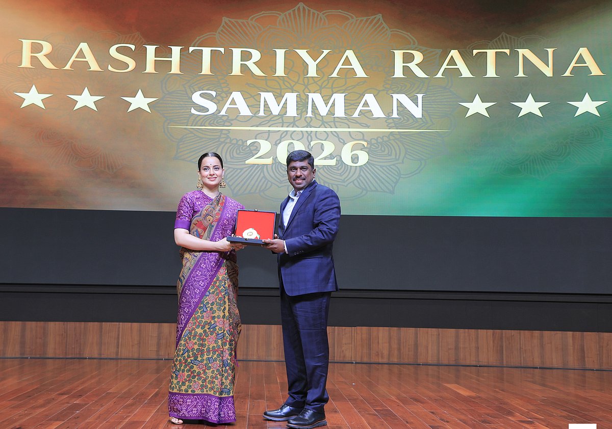 Sathesh Murthy receiving an award