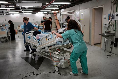 Medical staff transfer patients to a protected underground facility following an Iranian missile attack, at Ichilov Hospital in Tel Aviv, Israel.