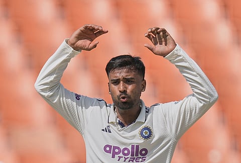 India's Manav Suthar reacts after bowling a delivery on day two of the cricket test match between Afghanistan and India in New Chandigarh.