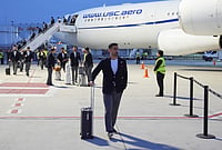 | Photo: AP/Gregory Bull : Iran's Ehsan Hajisafi arrives with his teammates for the World Cup soccer tournament in Tijuana, Mexico.