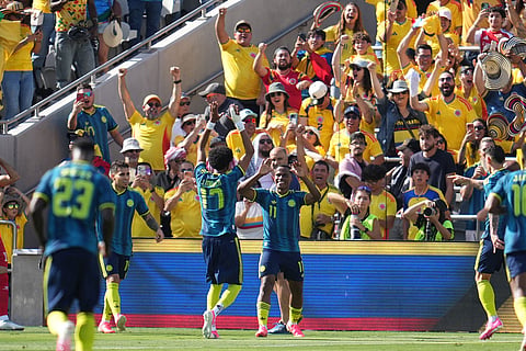 Colombia midfielder Jhon Arias (11) celebrates his goal with teammates during the first half of an international friendly soccer match against Jordan in San Diego.