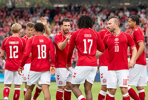 Denmark's players react after Patrick Dorgu scored against Ukraine during an international football match between Denmark and Ukraine, in Odense, Denmark. Player Christian Eriksen (10) is second right. 