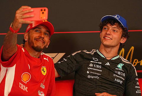 Mercedes driver Andrea Kimi Antonelli, right, of Italy, talks with Ferrari driver Lewis Hamilton, of Britain, during a press conference at the end of the Formula One Monaco Grand Prix race at the Monaco racetrack.