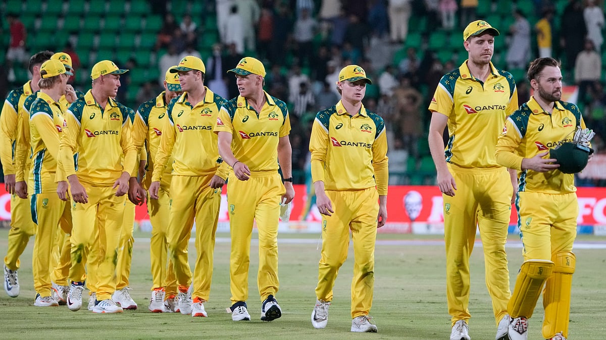 Australia's Josh Inglis, right, with teammates walk off the field on the end of the third one-day international cricket match between Pakistan and Australia, in Lahore, Pakistan. - AP Photo