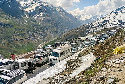 Vehicles remain stranded in a queue due to congestion at Rohtang Pass, in Manali, Himachal Pradesh.
