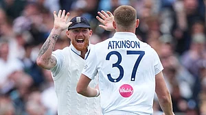 AP Photo : England's Gus Atkinson, right, celebrates with captain Ben Stokes after bowling out New Zealand's Matt Henry to win the Test match between England and New Zealand at Lord's cricket ground.