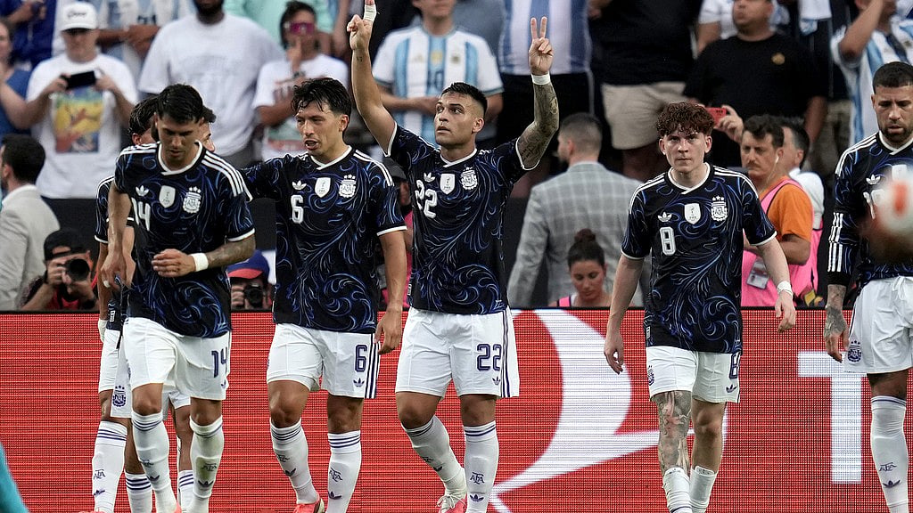 Argentina forward Lautaro Martínez (22) reacts after he scored on a penalty kick against Honduras during the first half of an international friendly soccer match. - AP Photo