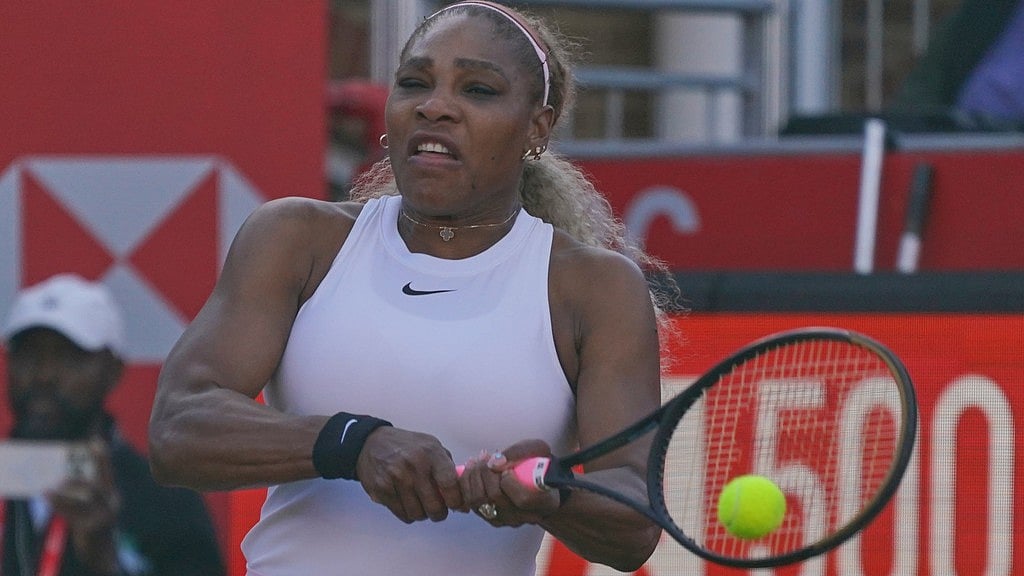 Serena Williams of the United States, hits a return as she and playing partner Victoria Mboko of Canada play against Nicole Melichar-Martinez of Canada and Erin Routliffe of New Zealand during their first round doubles match at the Queen's Club tennis championships in London. - AP Photo