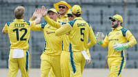 (AP Photo/Mosaraf Hossain) : Australia's Nathan Ellis, left, celebrates with teammates the wicket of Bangladesh's Saif Hassan during the first one day international cricket match between Australia and Bangladesh in Mirpur, Bangladesh, Tuesday, June 9, 2026